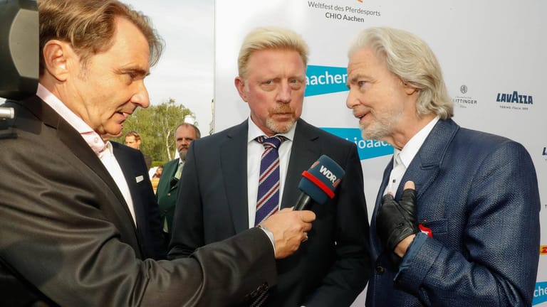 Boris Becker (M.) und Hermann Bühlbecker (r.) bei der "Media-Night" im Rahmen des Reitsportturniers CHIO Aachen 2019, das Lambertz sponsert.