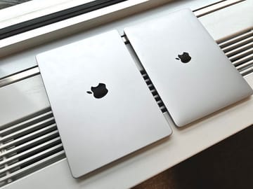 New 14" MacBook Pro (left) next to the case of the 13, which has been used for several years" MacBook Pro.