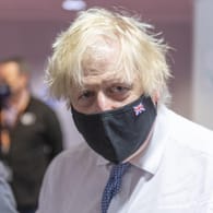 Boris Johnson, Premierminister von Großbritannien, mit Maske: "Lernen mit dem Virus zu leben".