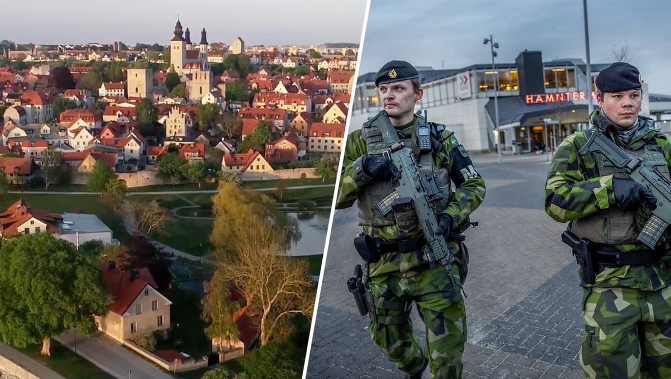 Die Stadt Visby auf der schwedischen Insel Gotland, zwei schwedische Soldaten auf der Insel (Archivbild): Immer mehr Militär bezieht auf Gotland Stellung.