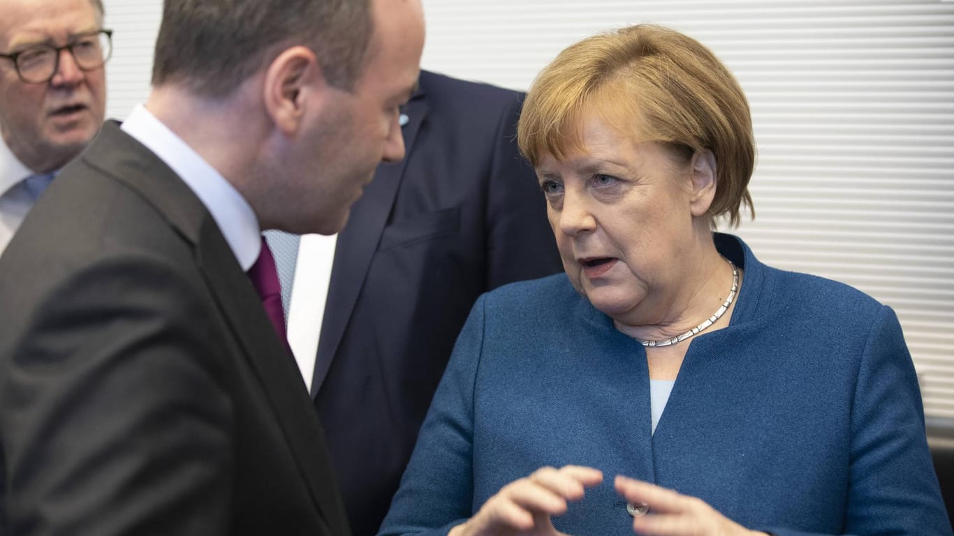 Manfred Weber, Angela Merkel.