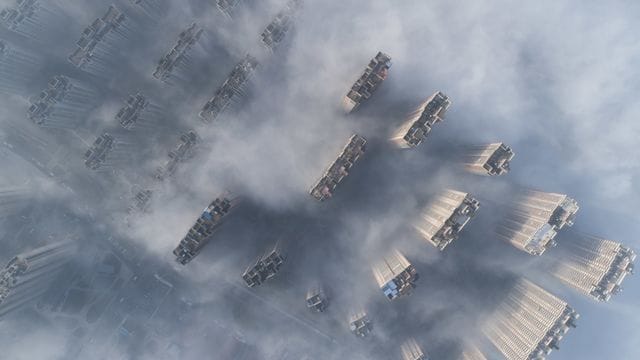 Hochhäuser im chinesischen Nanton ragen aus dem Smog heraus.