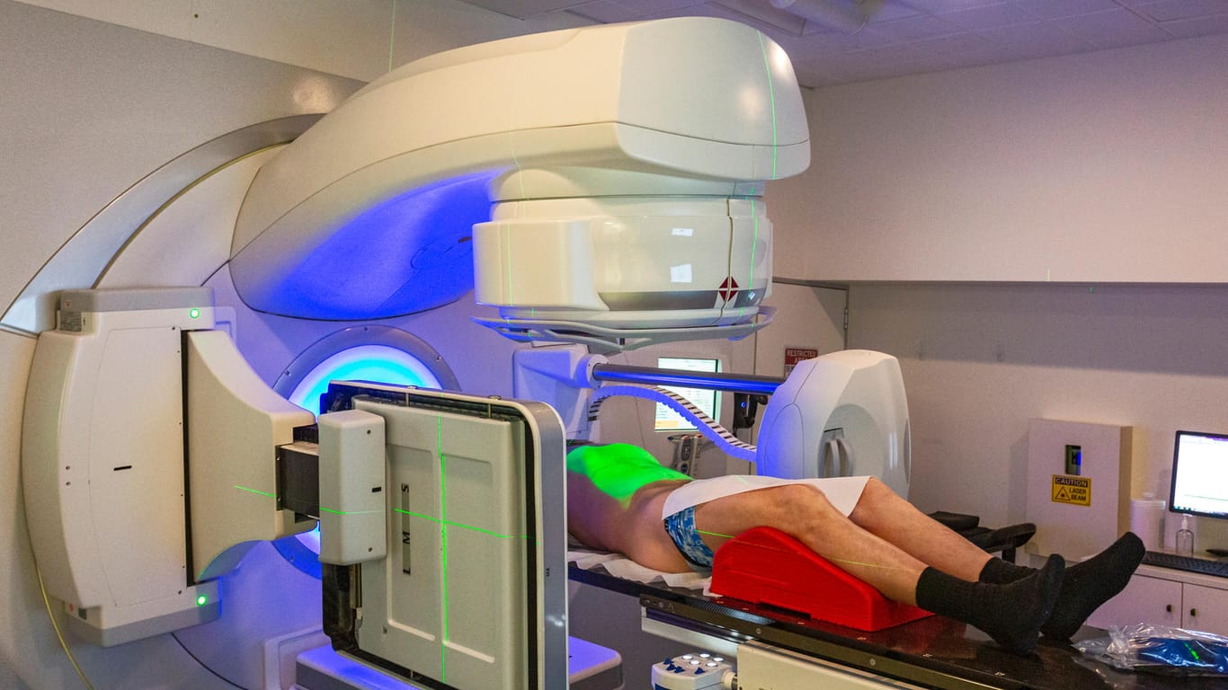 Senior adult male undergoing radiotherapy for prostate cancer (real people)