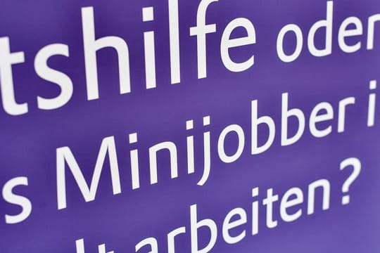 Das Wort "Minijobber" ist auf einem Plakat zu lesen