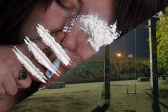Eine Frau schnupft Koks – Blick in den Berliner Mauerpark bei Nacht: In der Berliner Partyszene ist der Konsum von illegalen Drogen weit verbreitet.