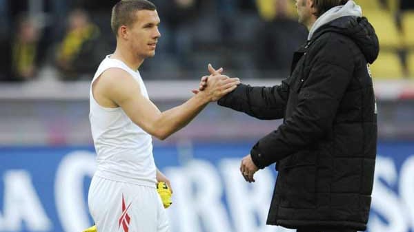 Kommen eigentlich gut miteinander aus: Lukas Podolski (li.) und Jürgen Klopp. Kommen eigentlich gut miteinander aus: Lukas Podolski (li.) und Jürgen Klopp.