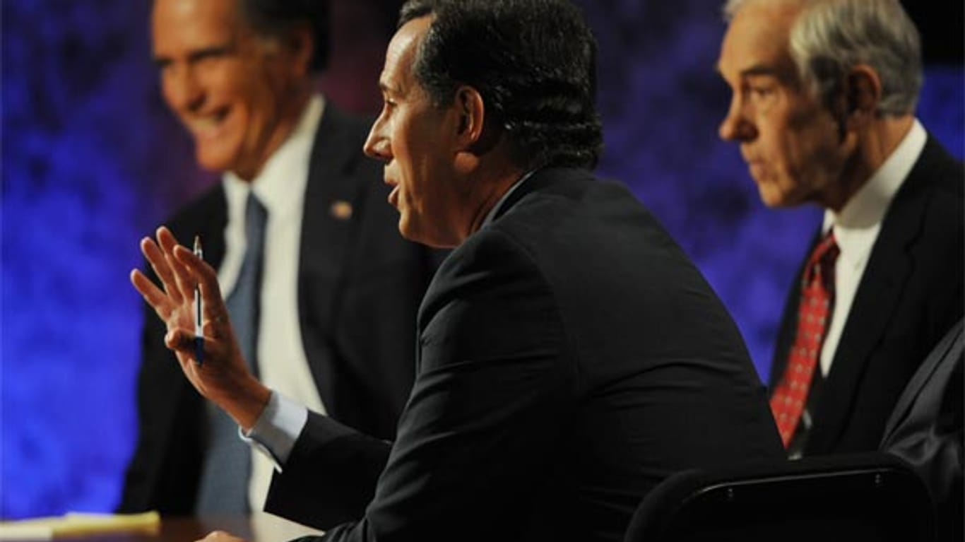 Mitt Romney (von links) und Rick Santorum liegen bei den Vorwahlen in Iowa bei 25 Prozent. Ron Paul ist ihnen dicht auf den Fersen
