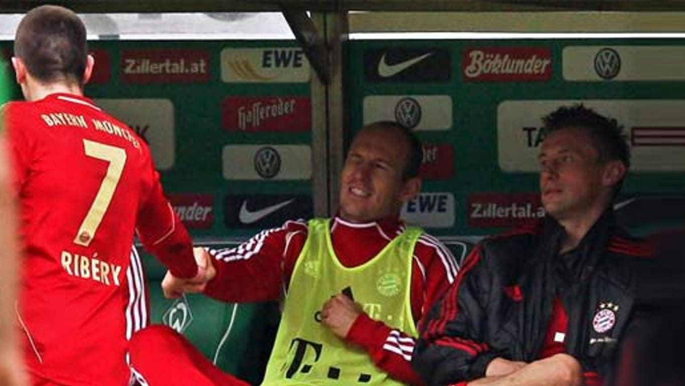 Hand- statt Faustschlag: Franck Ribéry und Arjen Robben klatschen sich ab.