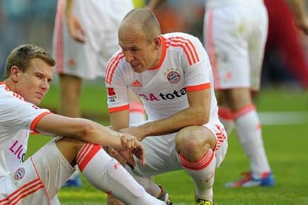 Holger Badstuber und Arjen Robben müssen auf die große Bayern-Party noch warten.