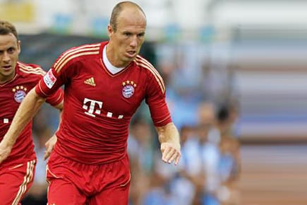 Werbeträger in Aktion: Die Münchner Rafinha (li.) und Arjen Robben.