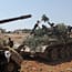 Schwere Waffen wie diese Panzer, die die Freie Syrische Armee vor den Toren der Stadt erbeutet hat, haben die Aufständischen nur selten.