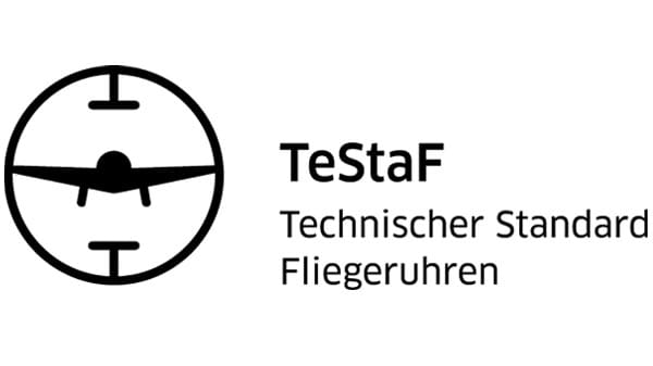 Das TeStaF-Logo: Uhren mit einem TeStaF-Zertifikat dürfen sich mit dem entsprechenden Logo schmücken. Dies wurde einem künstlichen Horizont aus dem Cockpit eines Flugzeuges entlehnt, es zeigt eine stilisierte Flugzeug-Silhouette von vorne - wenn auch ohne Leitwerk.