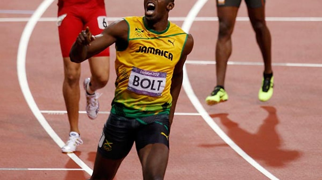 Usain Bolt schreit seine Freude über den historischen Triumph heraus.