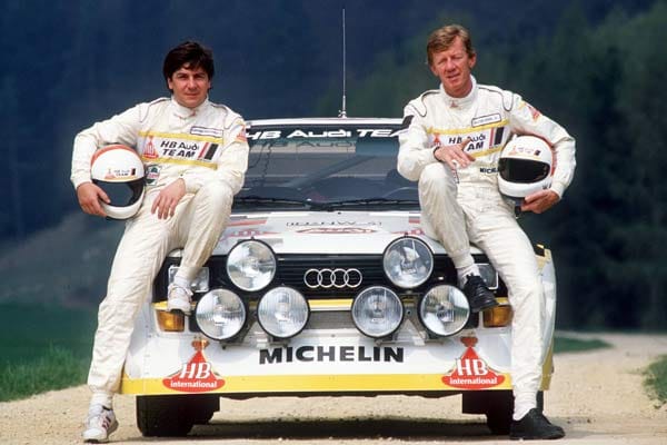Wer kennt sie nicht: Walter Röhrl und sein Beifahrer Christian Geistdörfer machten in der 1980er Jahren den Rallye-Sport und den Audi Quattro in Deutschland berühmt. Zweimal (1980 und 1982) feierte das Duo den WM-Titel.