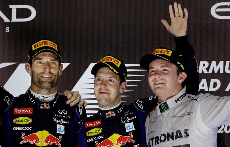 Am Ende des Tages jubelt Sebastian Vettel (Mi.) über den siebten Sieg in Serie. Mark Webber (li.) und Nico Rosberg werden Zweiter und Dritter.