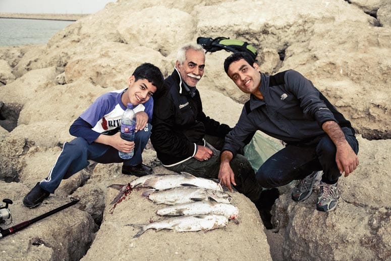 Frisch gefangen! Drei stolze Fischer im Iran.