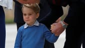 Zunächst zeigte sich der kleine Prinz noch etwas eingeschüchtert und versteckte sich hinter seinem Papa William.