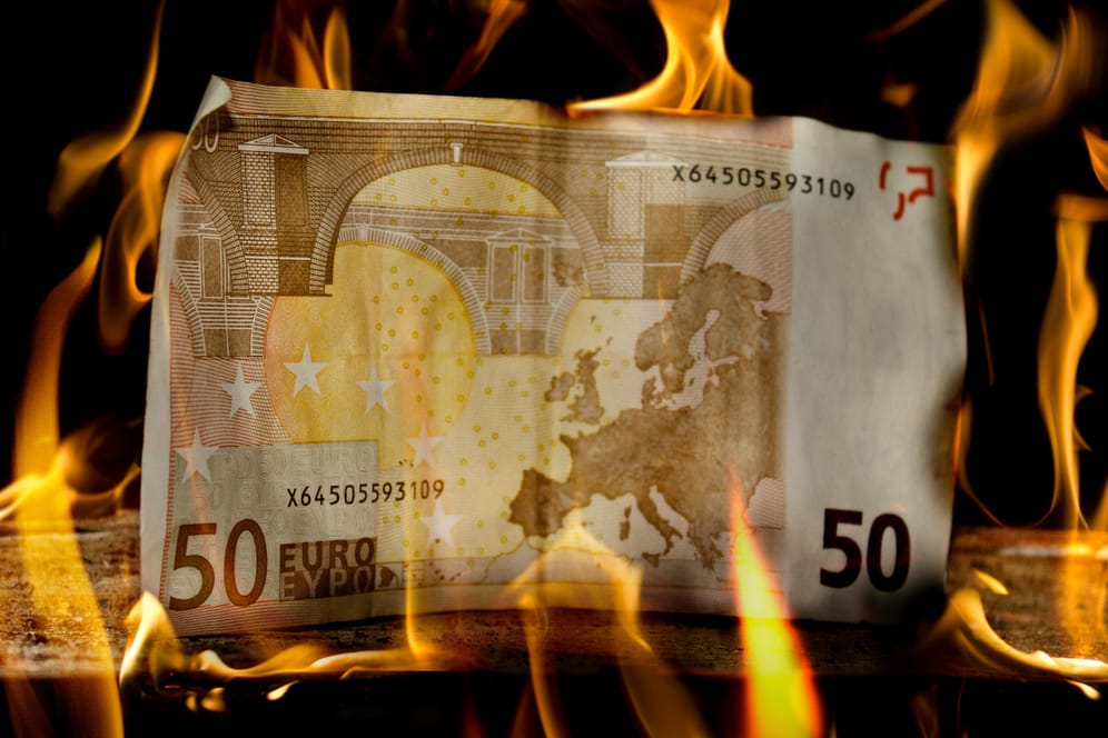 50 Euro money bill on wood just about to burn