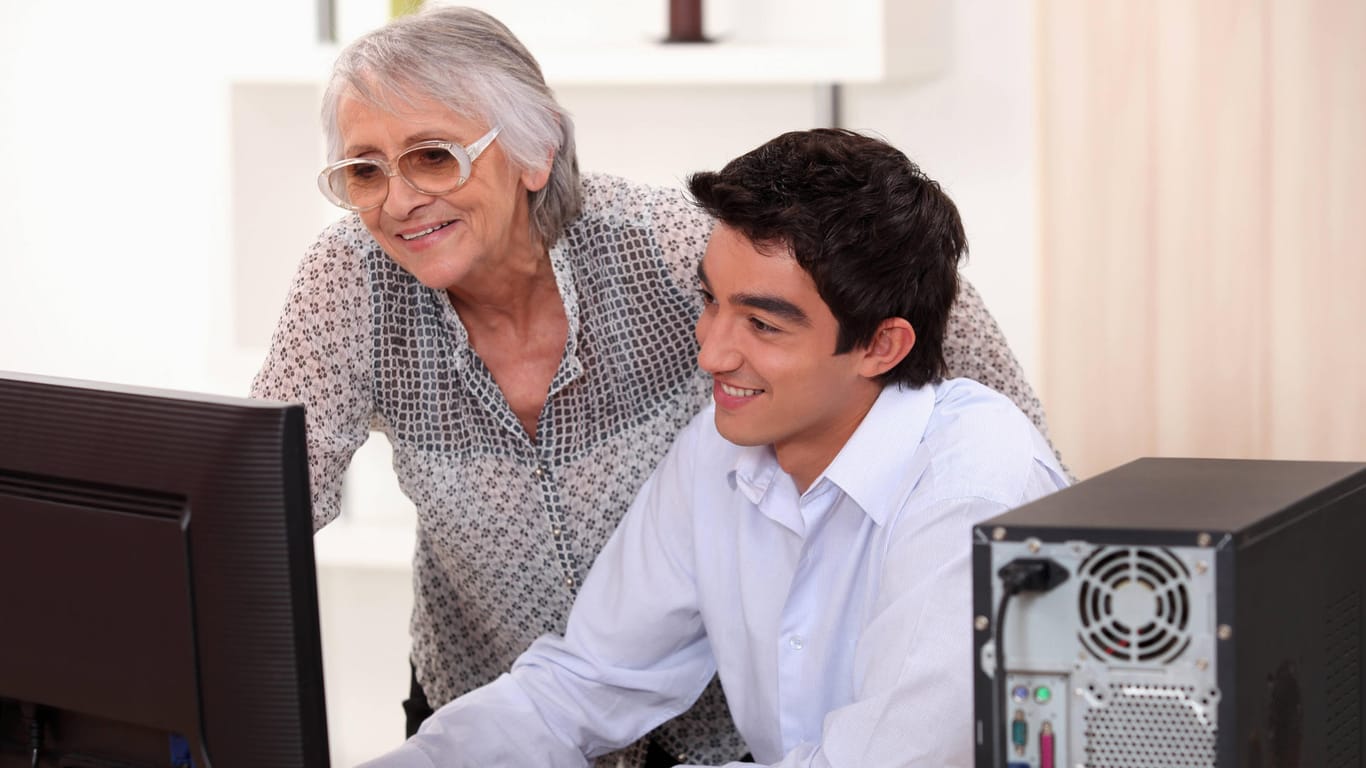 Young man helping his grandma with her computer., model released, , 5653444.jpg, activity, aged, beautiful, brown, casua