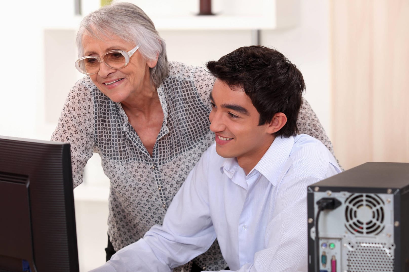 Young man helping his grandma with her computer., model released, , 5653444.jpg, activity, aged, beautiful, brown, casua