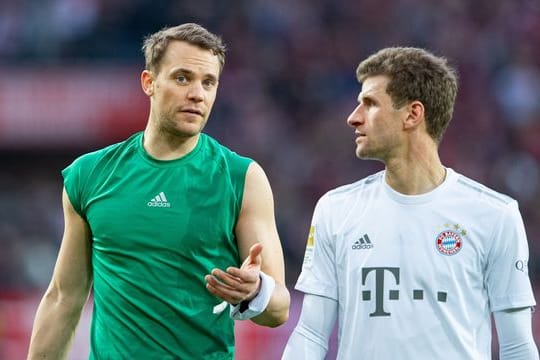 Bayerns Manuel Neuer (l) und Thomas Müller.