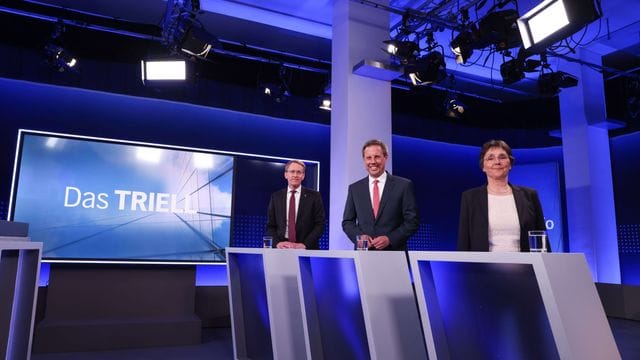 Daniel Günther (l-r), Thomas Losse-Müller und Monika Heinold