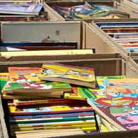 Werden von Kindern und Erwachsenen gern gelesen (Symbolfoto): Geschichten aus Entenhausen. In Berlin verschenken Buchläden heute den ganzen Tag verschiedene Comics.