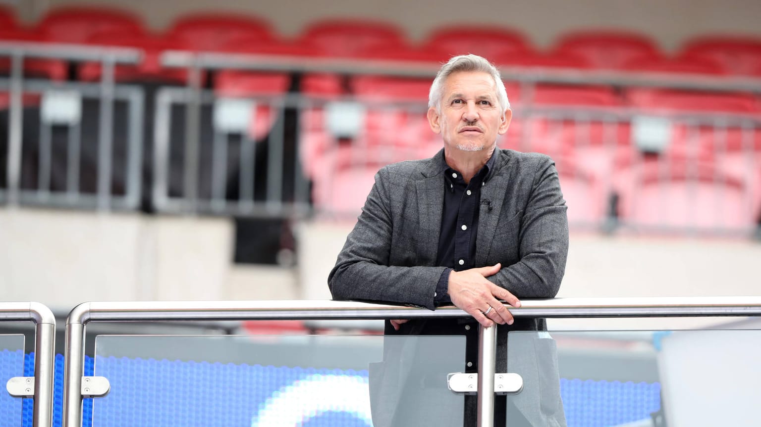 Gary Lineker watches the game, whilst working for the BBC Match of the Day team at the Emirates FA Cup Semi-Final match