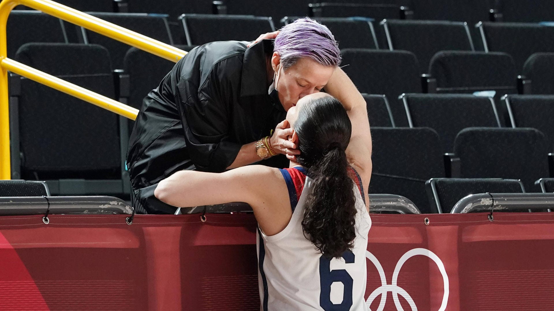 Sue Bird, 6, is congratulated by her partner USA soccer player Megan Rapinoe after United States women s basketball tea