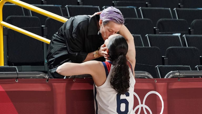 Sue Bird, 6, is congratulated by her partner USA soccer player Megan Rapinoe after United States women s basketball tea