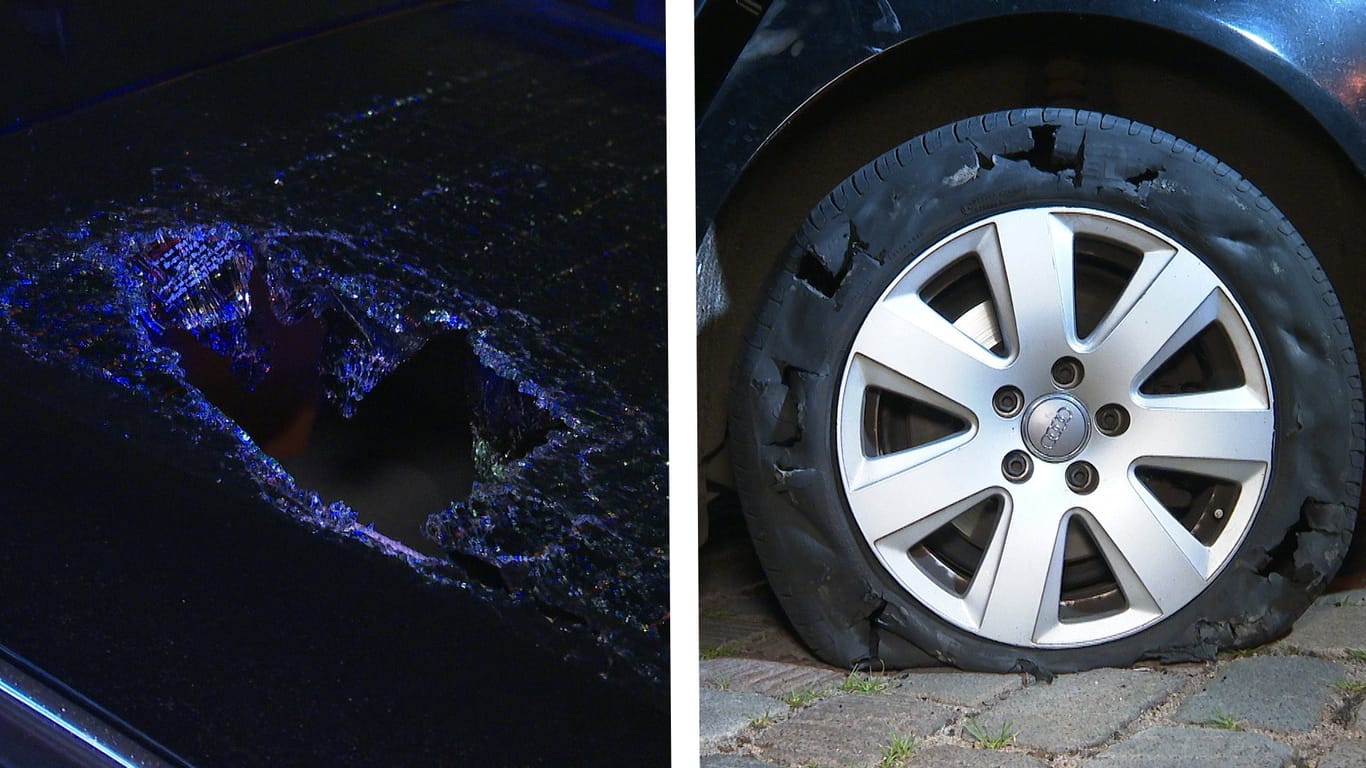 Ein Loch in der Heckscheibe sowie ein kaputter Reifen weisen auf einen Angriff des Fahrzeugs hin.