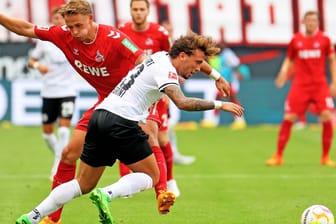Kein Sieger: Kölns Olesen (li.) gegen Frankfurts Pellegrini.