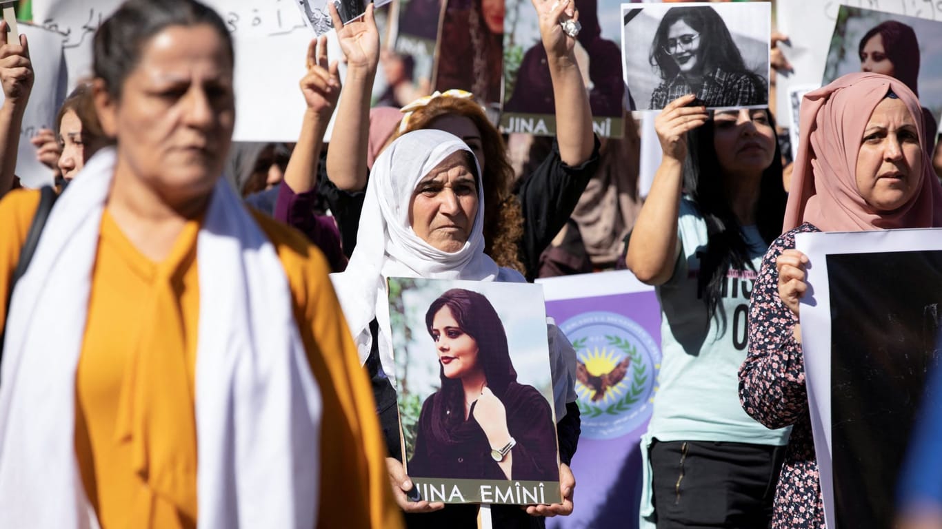 Women protest over the death of Mahsa Amini in Iran, in the Kurdish-controlled city of Qamishli