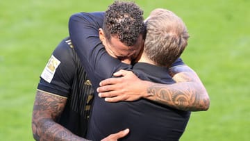 Emotional farewell: Boateng (left) hugs Flick after his last game for Bayern.