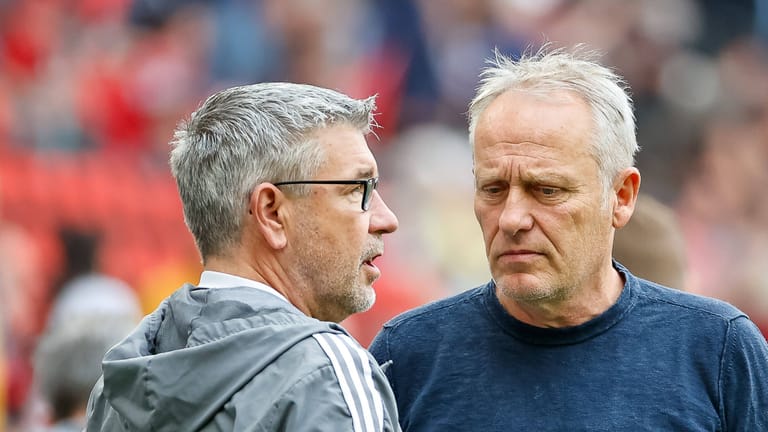 Urs Fischer (l.) und Christian Streich: Die beiden Trainer werden in der Europa League fehlen.