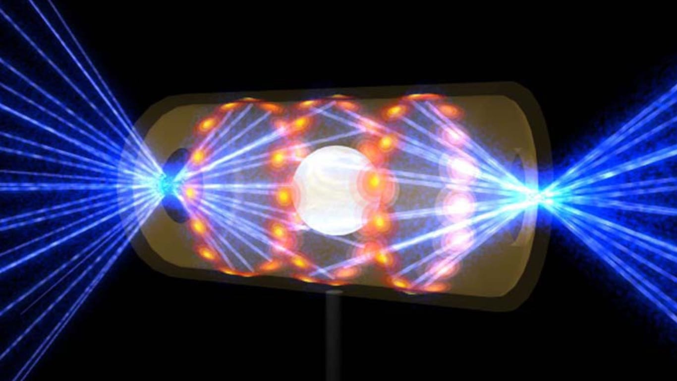 Ein NIF-Target-Pellet in einer Hohlraumkapsel mit Laserstrahlen, die durch Öffnungen an beiden Enden eintreten (Archivbild): Die Strahlen komprimieren und erhitzen das Target auf die Bedingungen, die für die Kernfusion erforderlich sind.