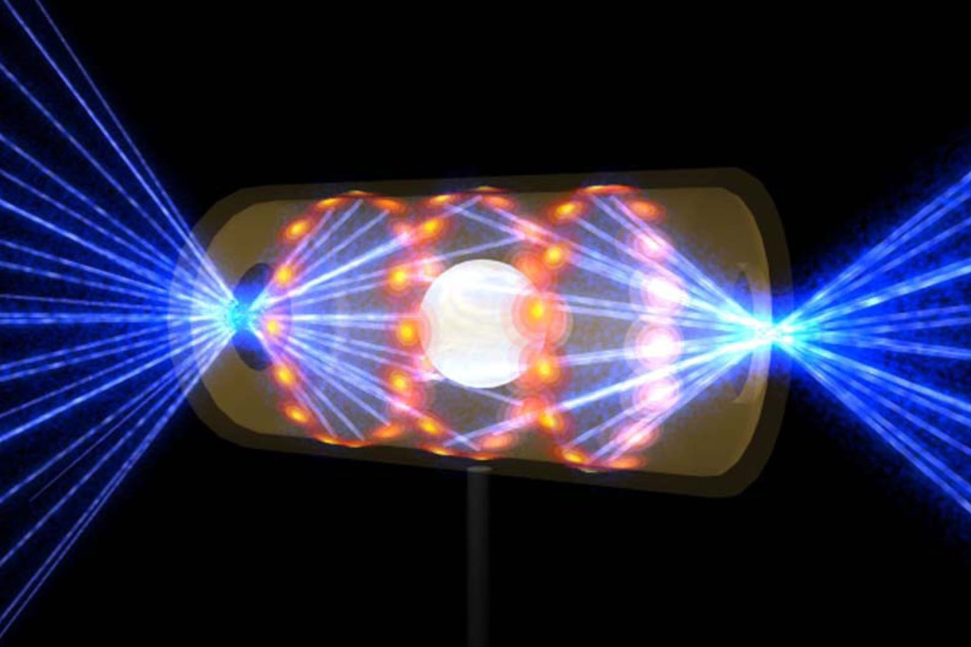 Ein NIF-Target-Pellet in einer Hohlraumkapsel mit Laserstrahlen, die durch Öffnungen an beiden Enden eintreten (Archivbild): Die Strahlen komprimieren und erhitzen das Target auf die Bedingungen, die für die Kernfusion erforderlich sind.