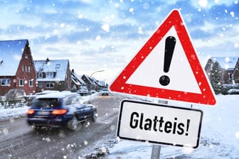Gefahrenschild mit Aufschrift Glatteis (Montage): Vor allem südlich von Hannover muss mit Glätte gerechnet werden.