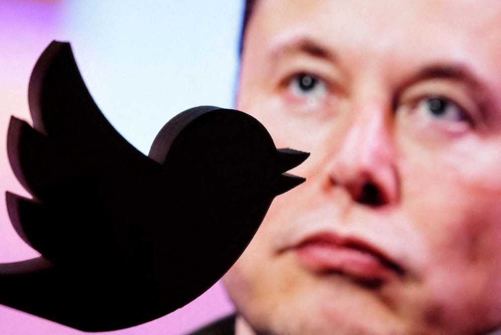FILE PHOTO: Illustration shows Elon Musk photo and Twitter logo