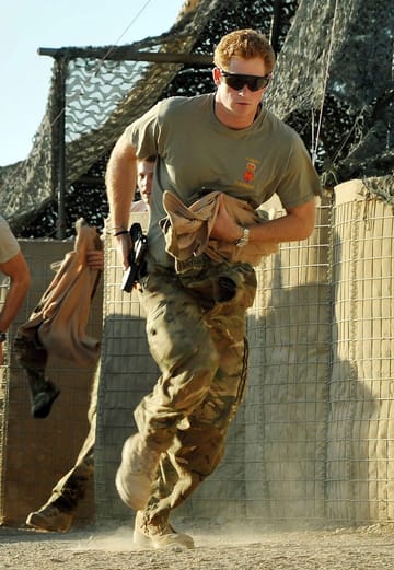 Afghanistan, Camp Bastion 2012: Britain's Prince Harry, or Captain Wales as he was known in the British Army, runs out of the VHR tent towards the Apache helicopter.