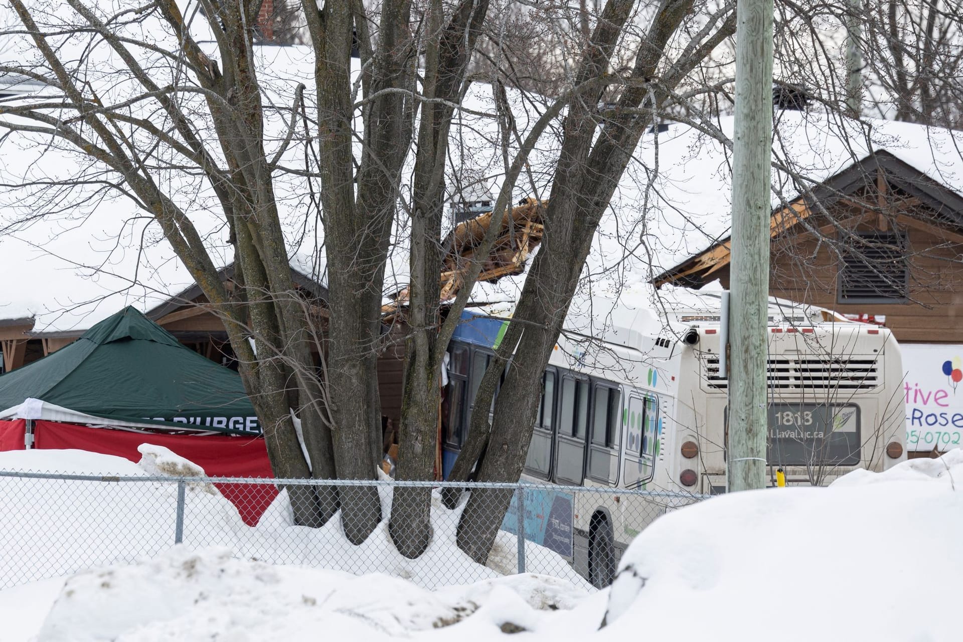 A Laval city bus is seen crashed into a daycare in Laval, Quebec