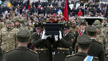 Soldiers carry the coffin during the memorial service for Dmytro Kotciopailo: Known as Da Vinci, Kotciopailo became a hero of Ukraine.
