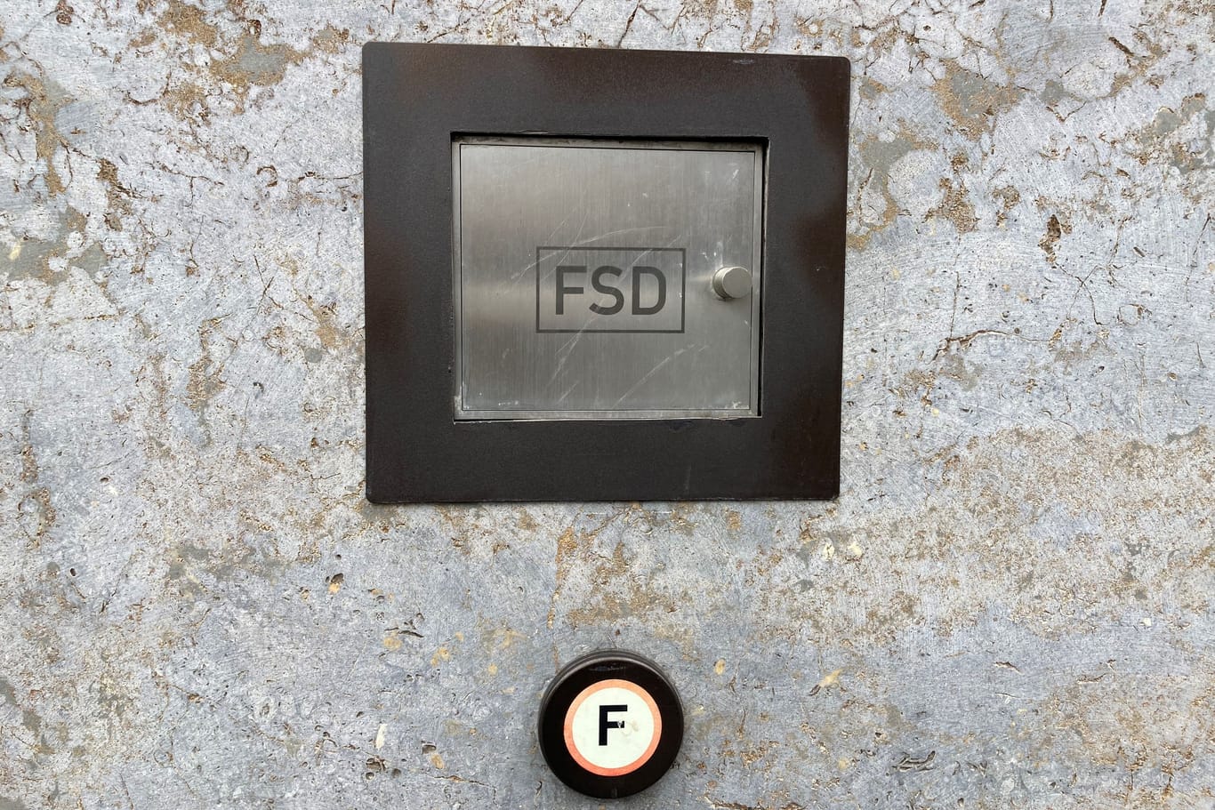FSD: The lettering is either on a small compartment door or as a sign in the immediate vicinity of it.