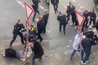 Bei Twitter kursiert ein Video der Prügelei: Man sieht, wie ein Faustschlag den Beamten trifft und die Frau zu Boden geht.