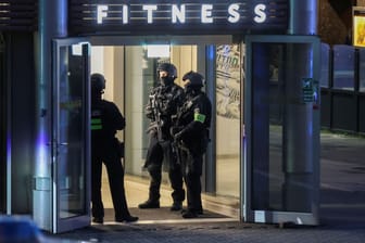 German special police forces work at a crime scene after a man seriously injured at least four people, in Duisburg