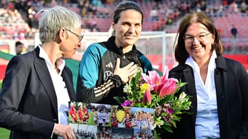 Moving farewell: Dszenifer Maroszan (centre) before the game  once morest Brazil kicks off.