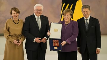 Frank-Walter Steinmeier (2nd from left), his wife Elke Buedenbender, Angela Merkel (2nd from right) and her husband Joachim Sauer: the ex-Chancellor became emotional at times.