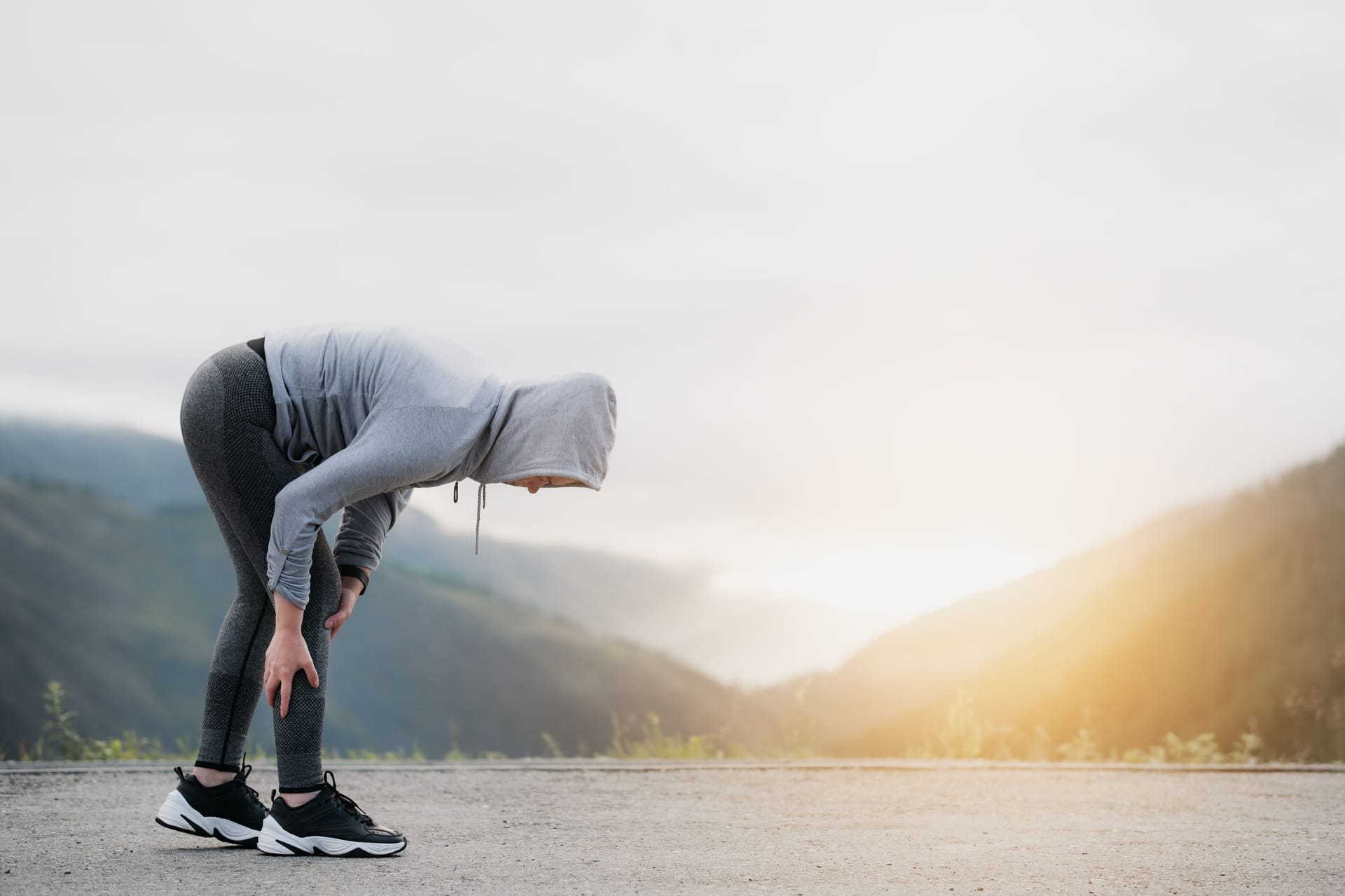 Joggerin mit Schmerzen in der Wade