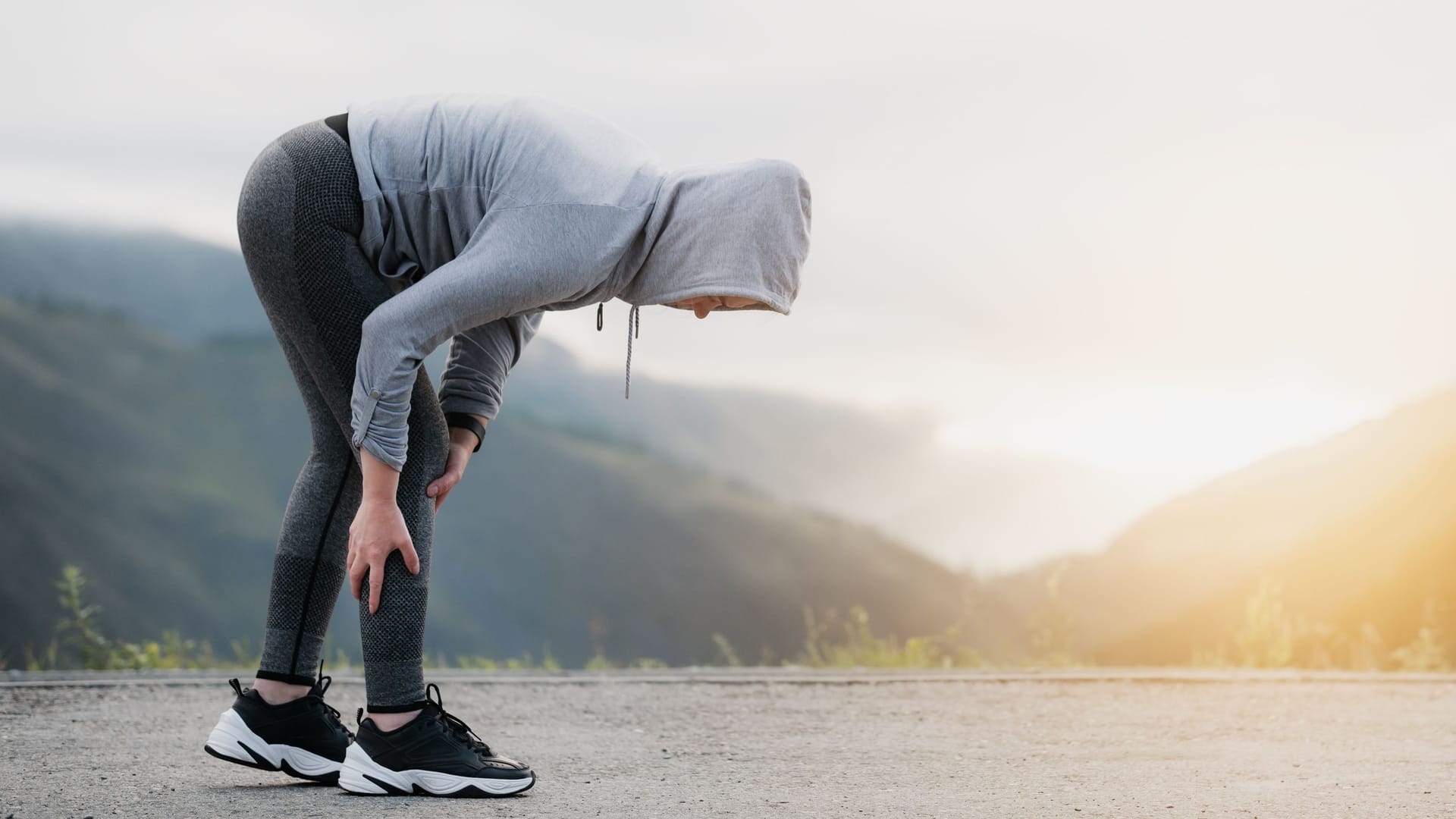 Joggerin mit Schmerzen in der Wade