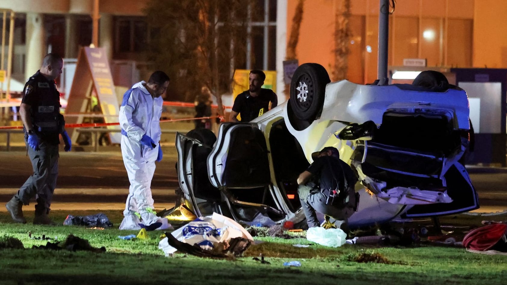 Israeli officials work at the scene of an attack in Tel Aviv Israeli officials work at the scene of an attack in Tel Aviv